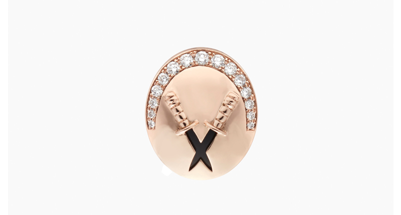 The “Dagny” pin in 18-karat rose gold with white diamond and onyx ($3,600)